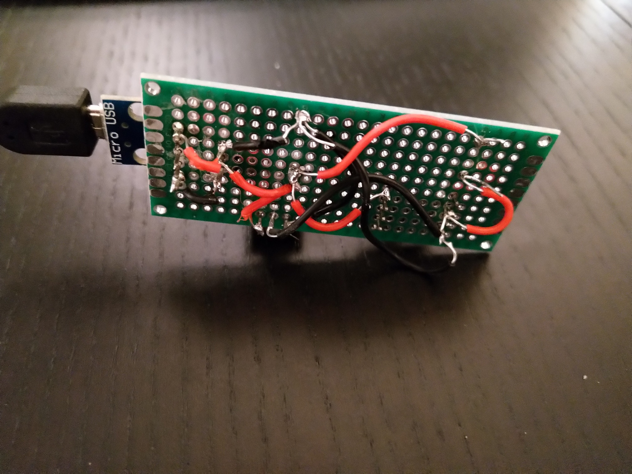 Figure 2: The back side looks quite sloppy. Also I messed up black/red wires from USB adaptor to voltage regulator.